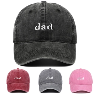 Close-up of vintage washed cotton baseball cap with white dad embroidery and six-panel structure