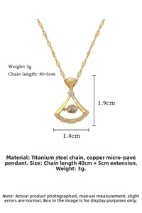 Macro detail of fan shaped gold necklace with dimensions 1.9cm by 1.4cm and steel chain