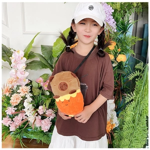 Detail view of a brown plush capybara crossbody bag for kids with cute doll design