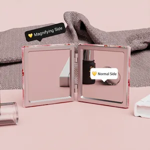 Portable pink floral folding makeup mirror with dual normal and magnifying glass views