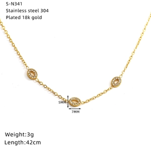 Detailed view of 18K gold plated stainless steel necklace with sparkling oval pendants