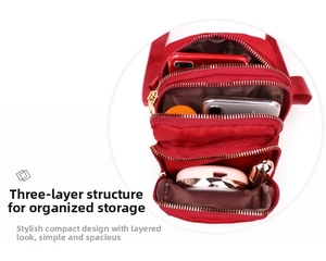 Detailed interior of red nylon crossbody mobile bag with three zipper compartments