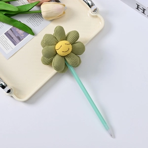 Close-up of cute green corduroy sunflower ballpoint pen on a stylish aesthetic tray
