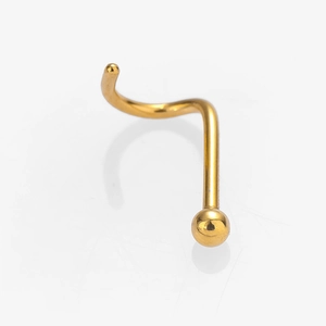 Macro view of a polished gold S-shaped stainless steel nose stud with a round bead tip