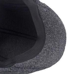 Detail of men winter hat showing herringbone wool texture and elastic inner band