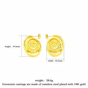 Detail showing 18K gold-plated stainless steel spiral earrings with 30.5mm height