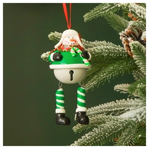 Detailed view of a snowman Christmas bell ornament hanging on a pine tree branch