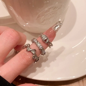 Geometric silver stackable rings set with wave design and sparkling zircon details