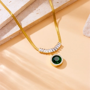 Elegant gold snake chain necklace with round emerald green pendant and sparkling diamonds