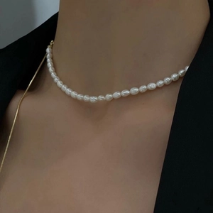 Elegant adjustable freshwater pearl necklace for women styled with a black suit jacket