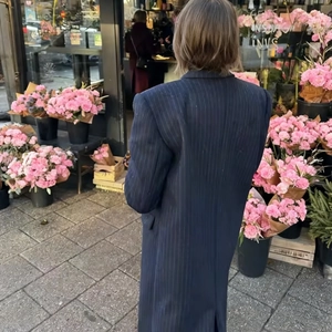 Classic vertical stripe long coat with waist slimming design in a stylish street style