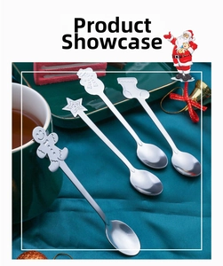 Close-up of stainless steel Christmas spoons with gingerbread man and snowman toppers