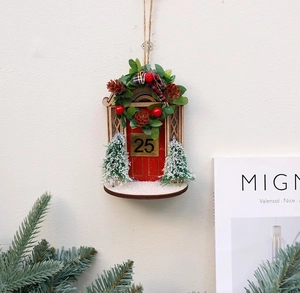 Christmas wooden house door ornament with red door, golden 25, wreath and snow pine trees