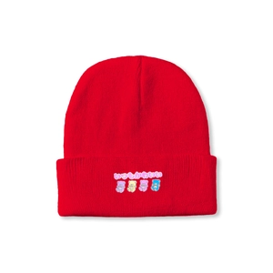 Detailed close-up of a red knit beanie featuring four colorful cartoon bear motifs and text