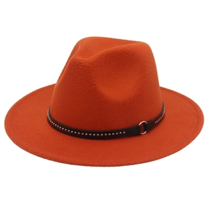 Detail of orange wool felt fedora with black leather band and silver metal rivets