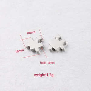 Technical drawing of silver stainless steel puzzle pendant showing size and hole diameter