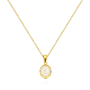 Detailed macro view of gold letter K necklace with oval white drip oil pendant detail