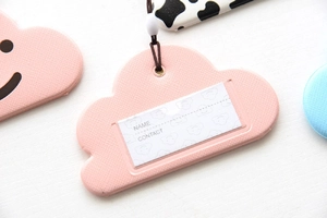 Pink cloud faux leather luggage tag featuring name and contact fields with brown strap