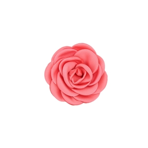 Detail of handmade coral pink satin camellia flower for hair accessories and garments