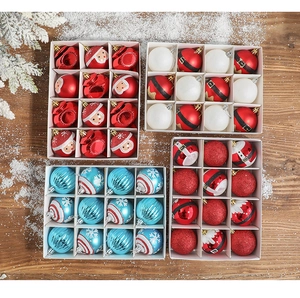 Flat lay of red and white Christmas balls with glitter snowflake on wooden background