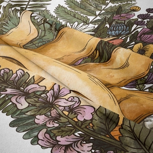 Detailed close-up of bohemian tapestry fabric with floral patterns and a yellow ribbon