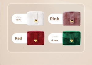 Mini velvet travel jewelry box with metal snap closure in white, pink, red, and green