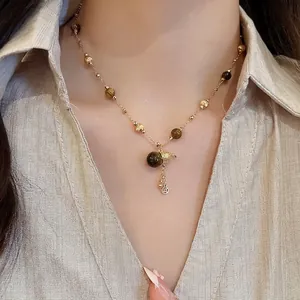 18K gold plated tiger eye stone necklace with gourd pendant and copper coin tassel detail