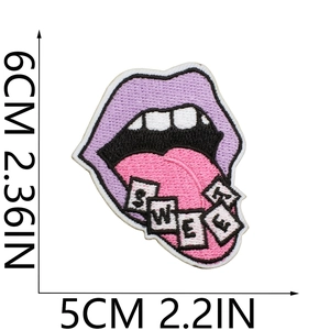 Detail view of purple tongue embroidery patch with Sweet text measuring 6cm by 5cm