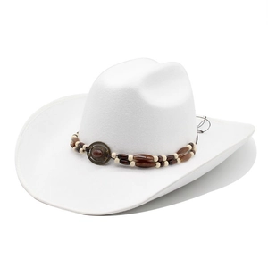 White wide brim western cowboy hat with bohemian beaded band and vintage metal emblem