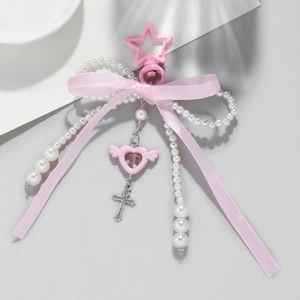 Pink star keychain with bow ribbon, faux pearls and winged heart cross pendants