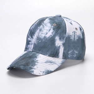Close-up of blue and white tie-dye cotton baseball cap with six-panel stitching details