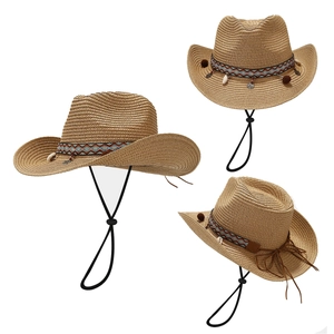 Straw cowboy sun hat with ethnic band and shell charms for beach vacation use