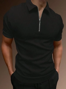 Close-up of black waffle knit texture and silver zipper on men's short sleeve polo shirt