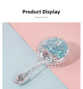 Detailed view of the round hair brush with colorful sequins inside the clear handle