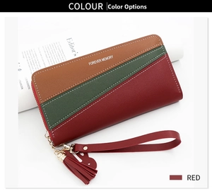 Detail of tricolor long zipper wallet in red green and brown with elegant tassel