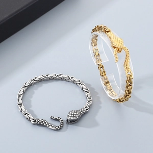 Detail of punk style Byzantine chain bracelet featuring a retro snake head clasp design