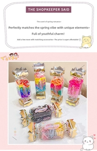 Detail of colorful high-elastic hair bands in unique candy-shaped gift boxes