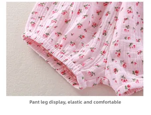 Close-up of baby floral cotton gauze dress set showing elastic cuffs and soft fabric