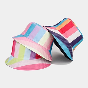 Colorful striped reversible bucket hats in pink, yellow and navy for outdoor sun protection