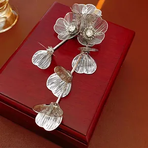 Elegant silver tassel flower brooch with sparkling rhinestones and hollow metal craft