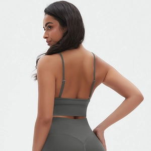 Detail view of seamless dark gray sports set showing adjustable straps and back fit