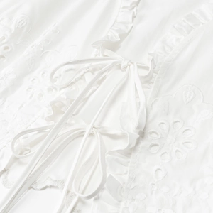Vintage white long sleeve blouse with embroidery ruffles and lace-up neck design