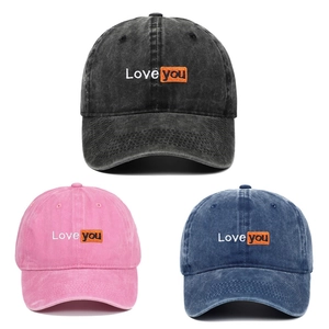 Three washed cotton baseball caps with Love you embroidery in black pink and denim blue colors