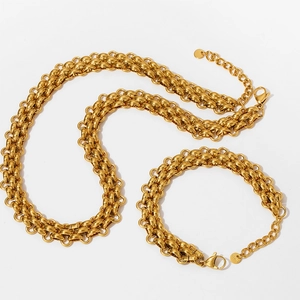 Detailed view of heavy punk style gold chunky chain necklace and bracelet set