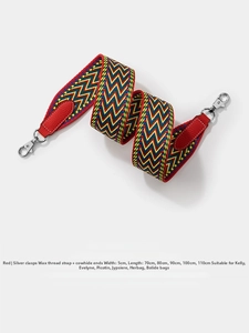 Close-up of 5cm wide colorful wavy woven bag strap with red leather ends and silver metal clips