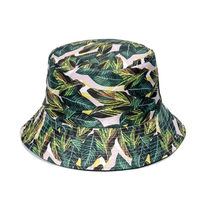 Tropical bucket hat with palm leaf and floral print for summer sun protection