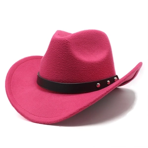 Detail of rose red wool felt cowboy hat with black leather band and silver studs
