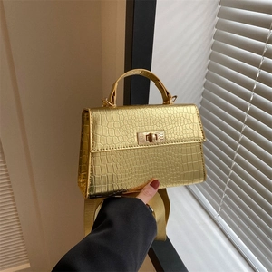 Golden crocodile texture square bag with metal twist lock and wide shoulder strap
