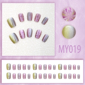 Faux ongles œil de chat avec dégradé violet jaune et motifs d'art pailletés
