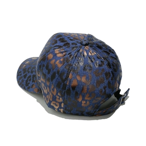 Detail view of the leopard print baseball cap with metallic finish and metal adjustment buckle